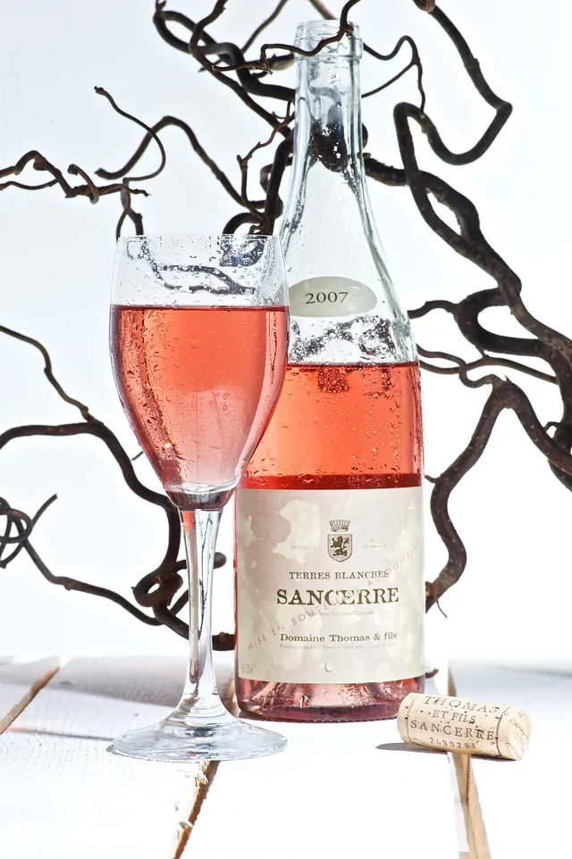 A bottle and a glass of Sancerre rosé