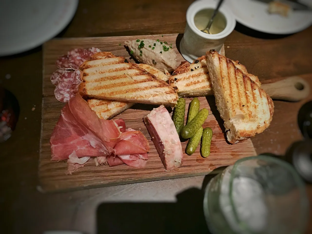 A board of pâté, pork rillettes, saucisson, Bayonne ham and cornichons