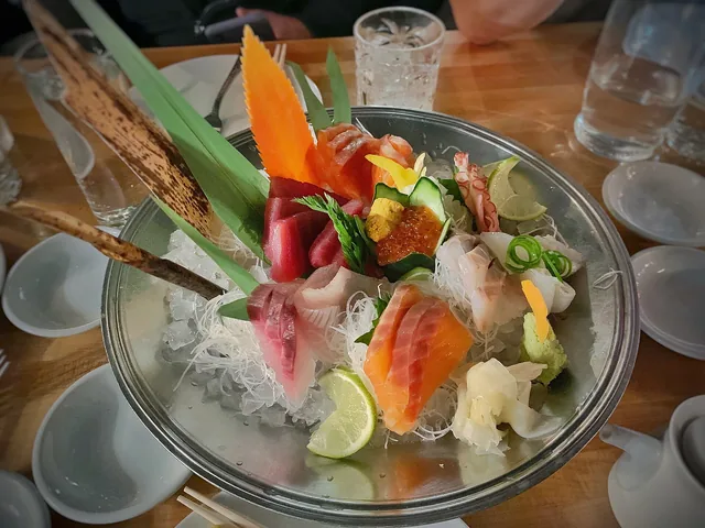 A sashimi platter of tuna, salmon, yellowtail and white fish on ice