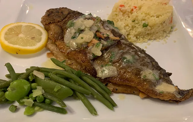 Pan-fried trout with almonds and parsley butter, green beans and lemon